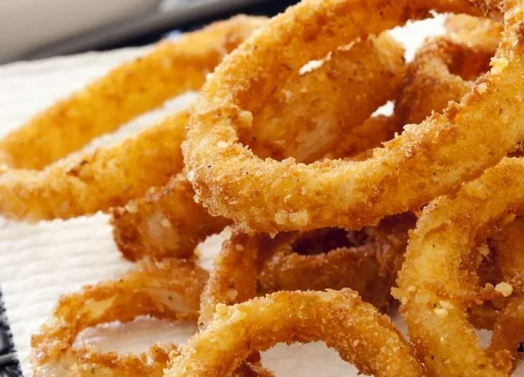 Crispy air fryer onion rings served in a bowl