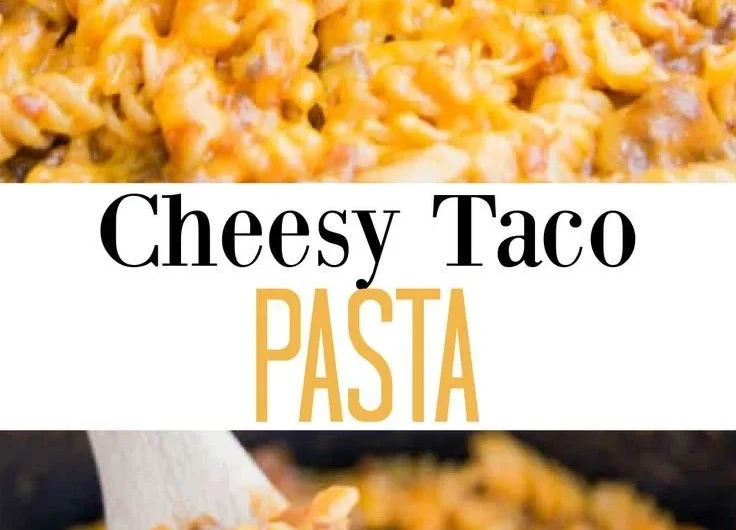 Dish of cheesy taco pasta topped with cheese and fresh herbs