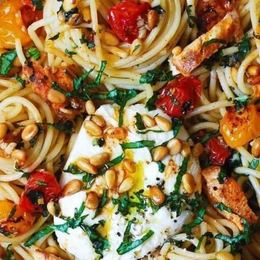 Lemon Butter Garlic Chicken Pasta topped with Roasted Cherry Tomatoes and Burrata Cheese