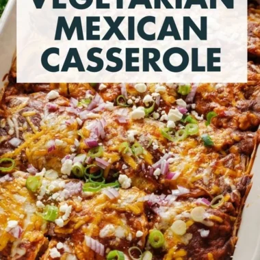 Delicious vegetarian enchilada casserole topped with cheese and fresh herbs.