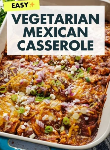 Delicious vegetarian enchilada casserole topped with cheese and fresh herbs.