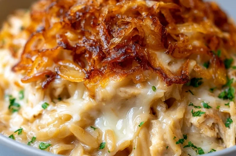 Delicious French onion chicken orzo casserole topped with melted cheese