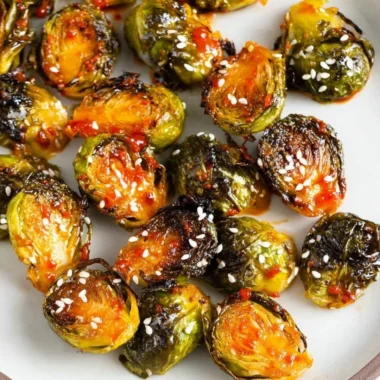 Bowl of Gochujang Roasted Brussels Sprouts with spicy seasoning