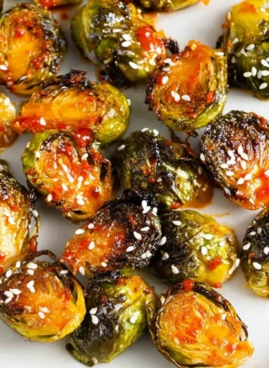 Bowl of Gochujang Roasted Brussels Sprouts with spicy seasoning