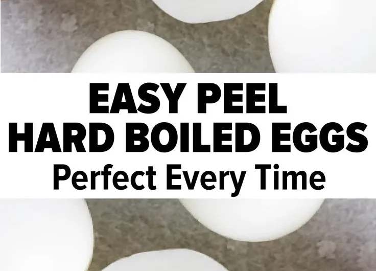 Perfectly cooked hard boiled eggs on a plate garnished with herbs