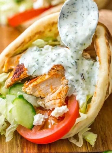 Delicious homemade chicken gyro served with fresh vegetables and tzatziki sauce.