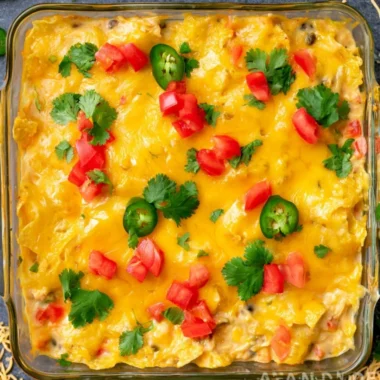 Delicious Mexican Chicken Casserole topped with cheese and peppers