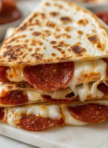 Delicious pepperoni pizza quesadilla served with dipping sauce