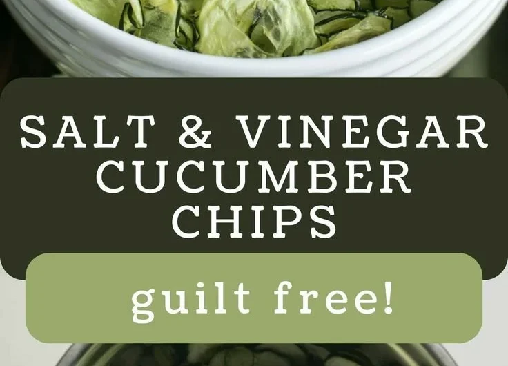 Bowl of homemade salt and vinegar cucumber chips on a wooden table