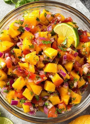 Sweet and spicy peach salsa with fresh ingredients in a bowl
