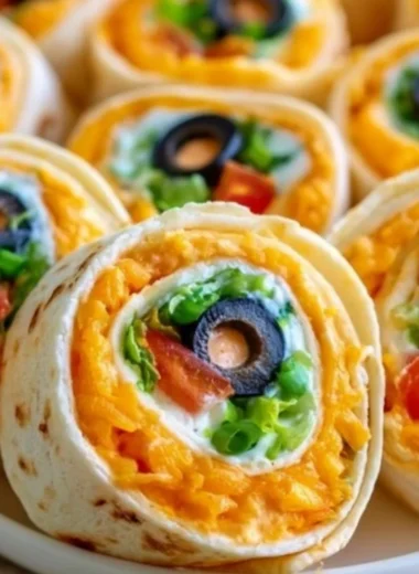 Taco Cream Cheese Pinwheels served on a platter with toppings