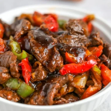 Delicious black pepper beef dish served with vibrant vegetables.
