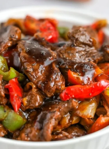 Delicious black pepper beef dish served with vibrant vegetables.