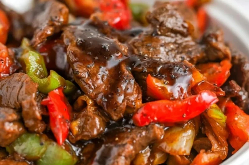 Delicious black pepper beef dish served with vibrant vegetables.