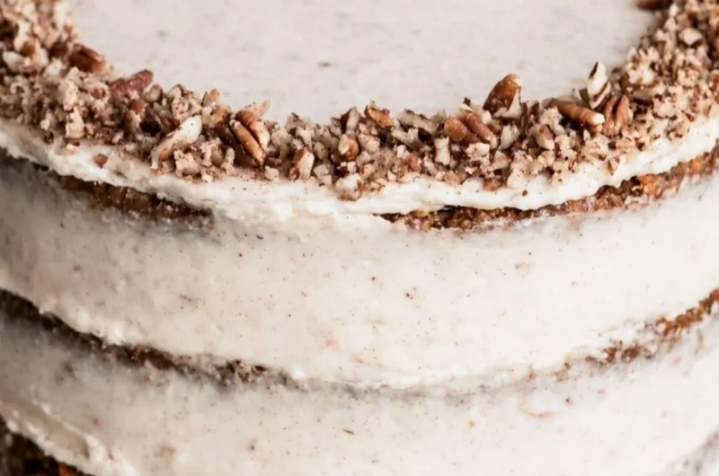 Delicious slice of Brown Butter Carrot Cake topped with cream cheese frosting