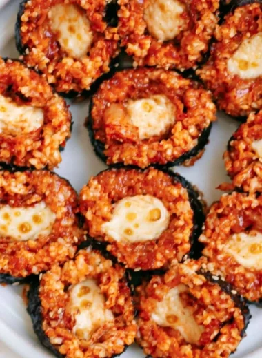 Delicious Cheese Kimchi Kimbap rolled with rice, cheese, and spicy kimchi