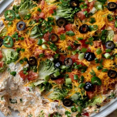 Cozy cottage cheese taco dip served in a bowl with tortilla chips.
