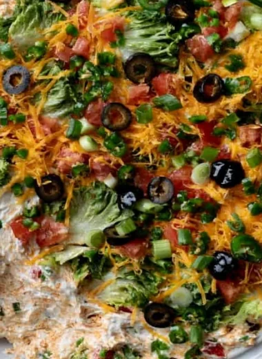 Cozy cottage cheese taco dip served in a bowl with tortilla chips.