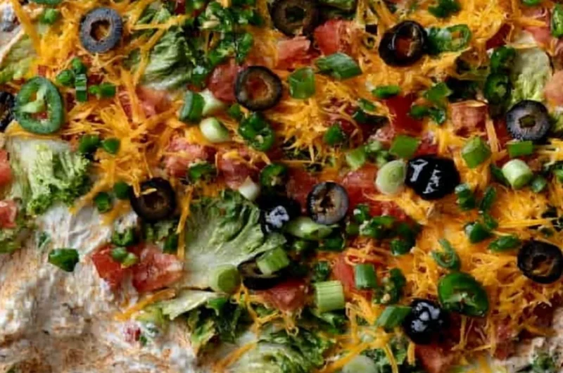 Cozy cottage cheese taco dip served in a bowl with tortilla chips.