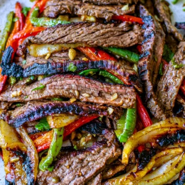 Delicious cozy steak fajitas served with peppers and onions