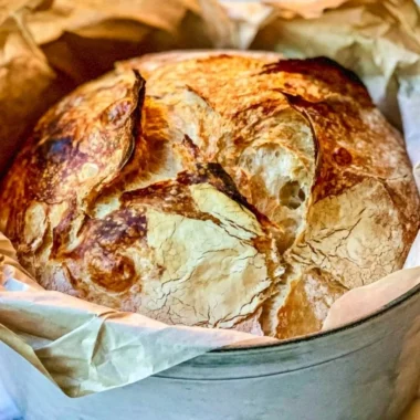 Freshly baked easy Dutch oven bread with a crispy crust.