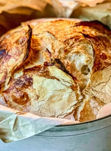 Freshly baked easy Dutch oven bread with a crispy crust.