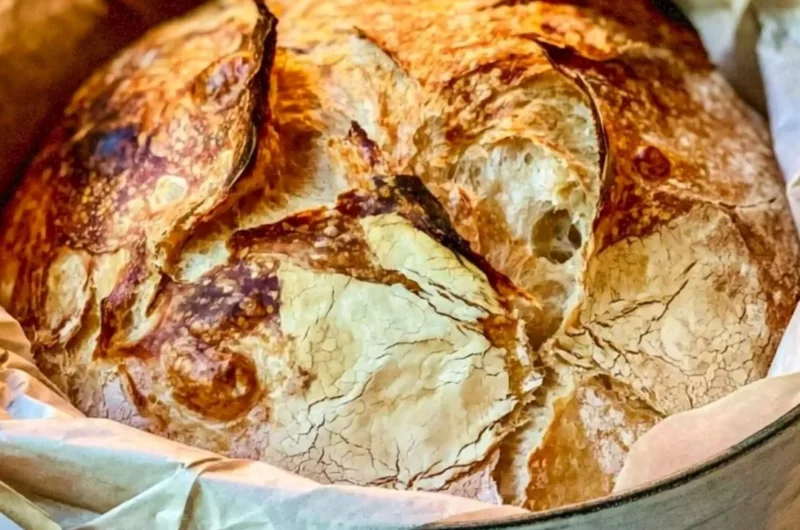Freshly baked easy Dutch oven bread with a crispy crust.