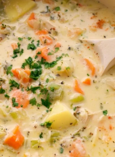 Bowl of easy leftover turkey soup with vegetables and herbs