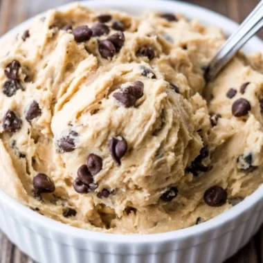 Edible chocolate chip cookie dough in a bowl with chocolate chips