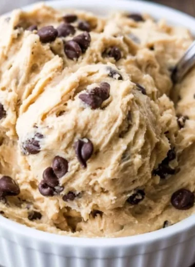 Edible chocolate chip cookie dough in a bowl with chocolate chips