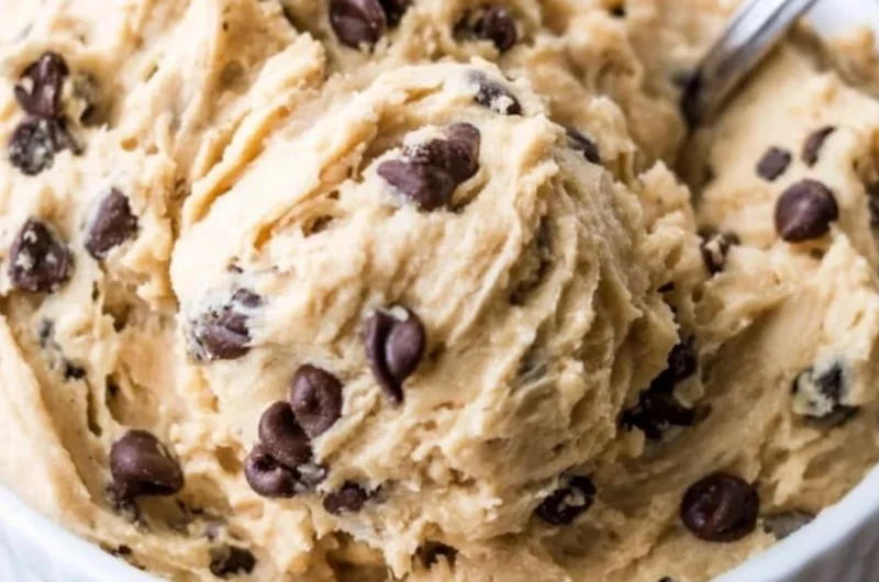 Edible chocolate chip cookie dough in a bowl with chocolate chips