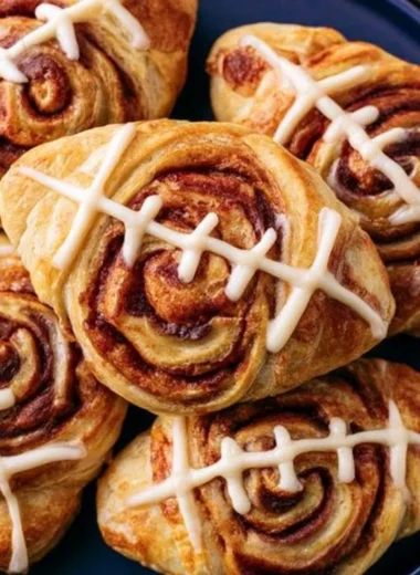 Delicious football-shaped cinnamon rolls ready for game day
