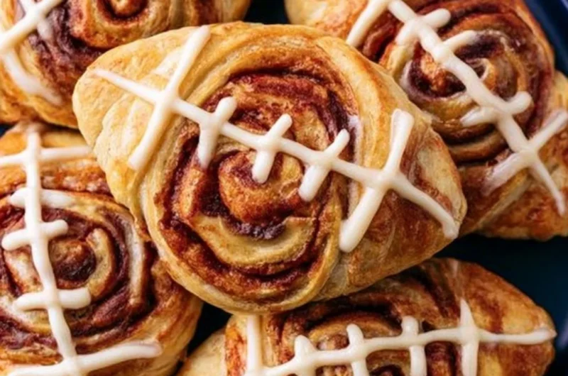 Delicious football-shaped cinnamon rolls ready for game day