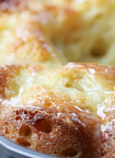 Delicious Lemon Bundt Cake with a bright icing glaze on a rustic table