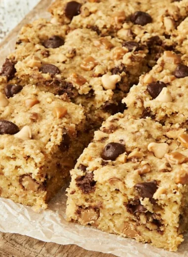 Delicious loaded chocolate chip cookie bars with gooey chocolate and a golden crust