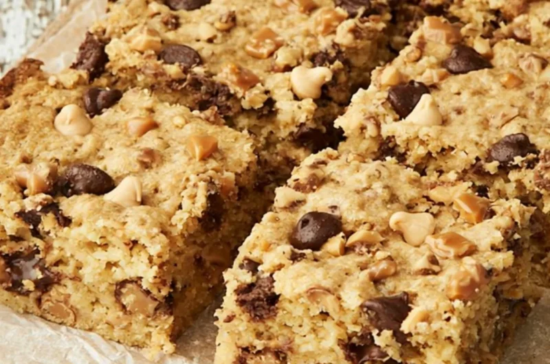 Delicious loaded chocolate chip cookie bars with gooey chocolate and a golden crust
