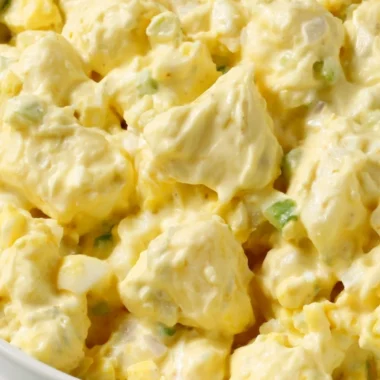 Delicious homemade potato salad served in a bowl with fresh herbs