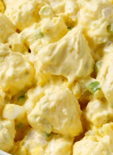 Delicious homemade potato salad served in a bowl with fresh herbs