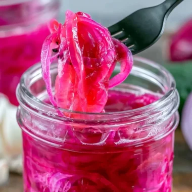 Jar of quick pickled red onions for delicious toppings and recipes