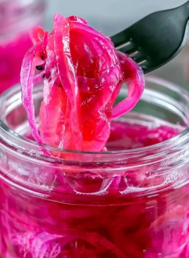 Jar of quick pickled red onions for delicious toppings and recipes