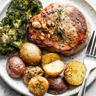 Sheet Pan Pork Chops with potatoes and broccoli ready to serve