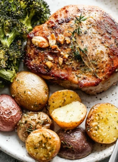 Sheet Pan Pork Chops with potatoes and broccoli ready to serve