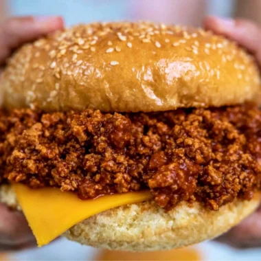 Delicious slow cooker sloppy joes served on buns with a side of fries.