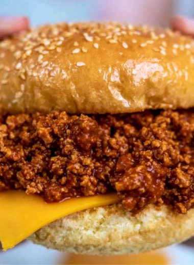 Delicious slow cooker sloppy joes served on buns with a side of fries.