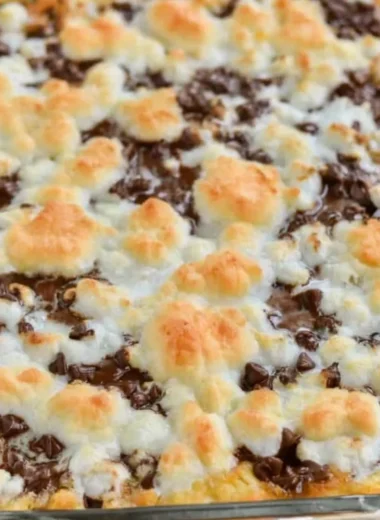 Delicious s'mores magic bars loaded with chocolate, marshmallows, and graham crackers.