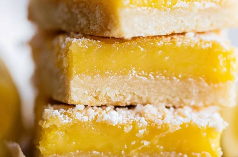Delicious super easy lemon bars with creamy lemon filling and golden crust
