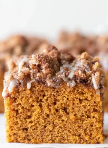 Delicious pumpkin cake with crumb topping and maple cream cheese glaze