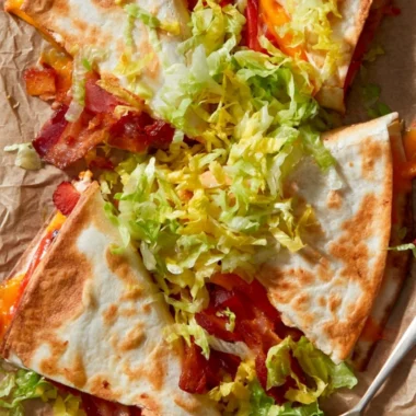 Delicious BLT quesadillas filled with crispy bacon, lettuce, and tomatoes
